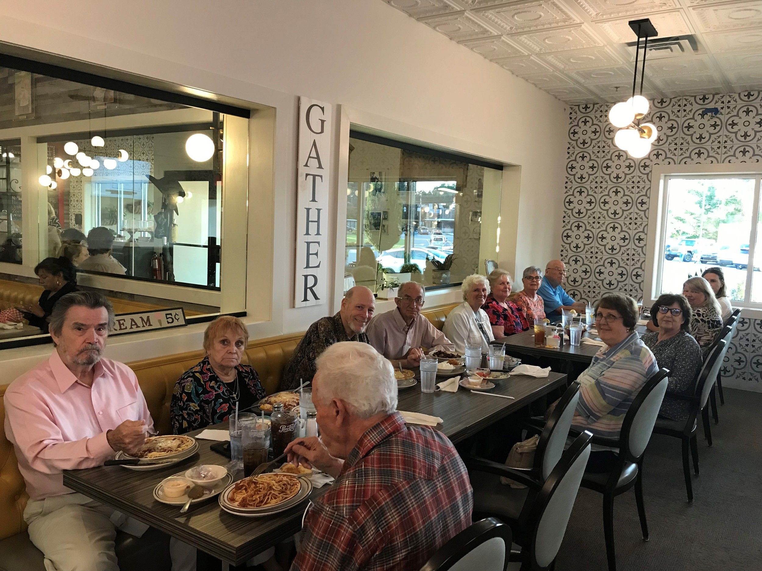 Seniors group meal together