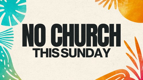Champion Church congregation during a church sermon with two screens displaying church lesson.