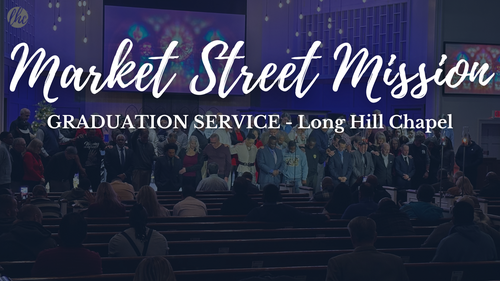 Group of men being celebrated on stage