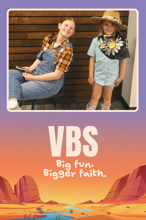 VBS - two girls dressed in western wear smiling.