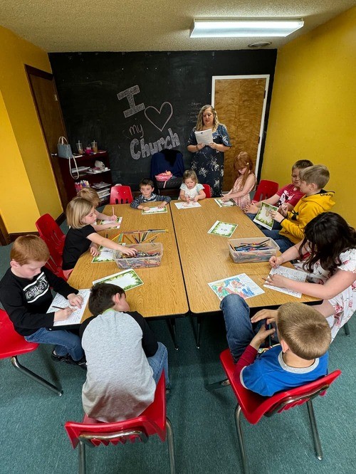 Members of First Southern Baptist Church in Pomeroy gathered around tables for fellowship and Bible study, showcasing the community and small group life of the church.