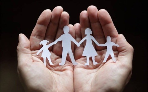 Paper family in hands