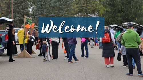 Photo of the front entrance of the church with the text 'Welcome!'