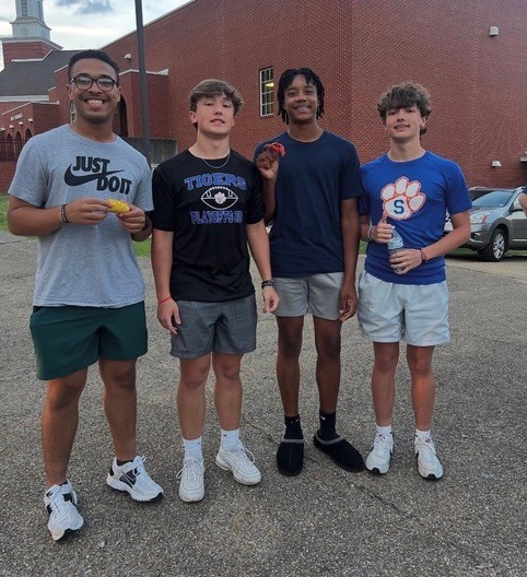 teenage girls smiling on a couch