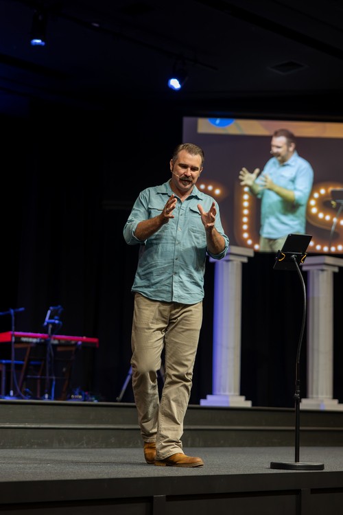 pastor preaching sermon on stage