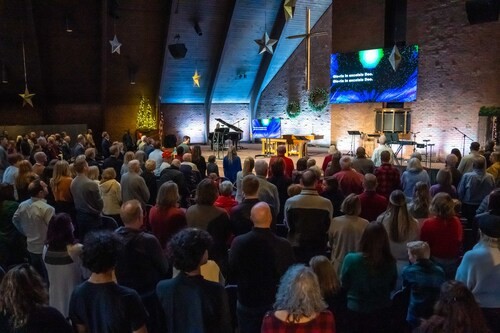 Band members singing in the Worship Center