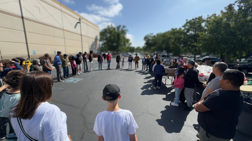 People praying in a circle before outreach 